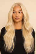 Model wearing the Platinum Blonde Body Wave Human Hair Wig by Hair Labs