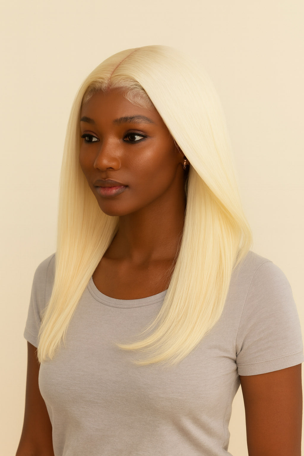 Model wearing the Platinum Blonde Bone Straight Human Hair Wig by Hair Labs